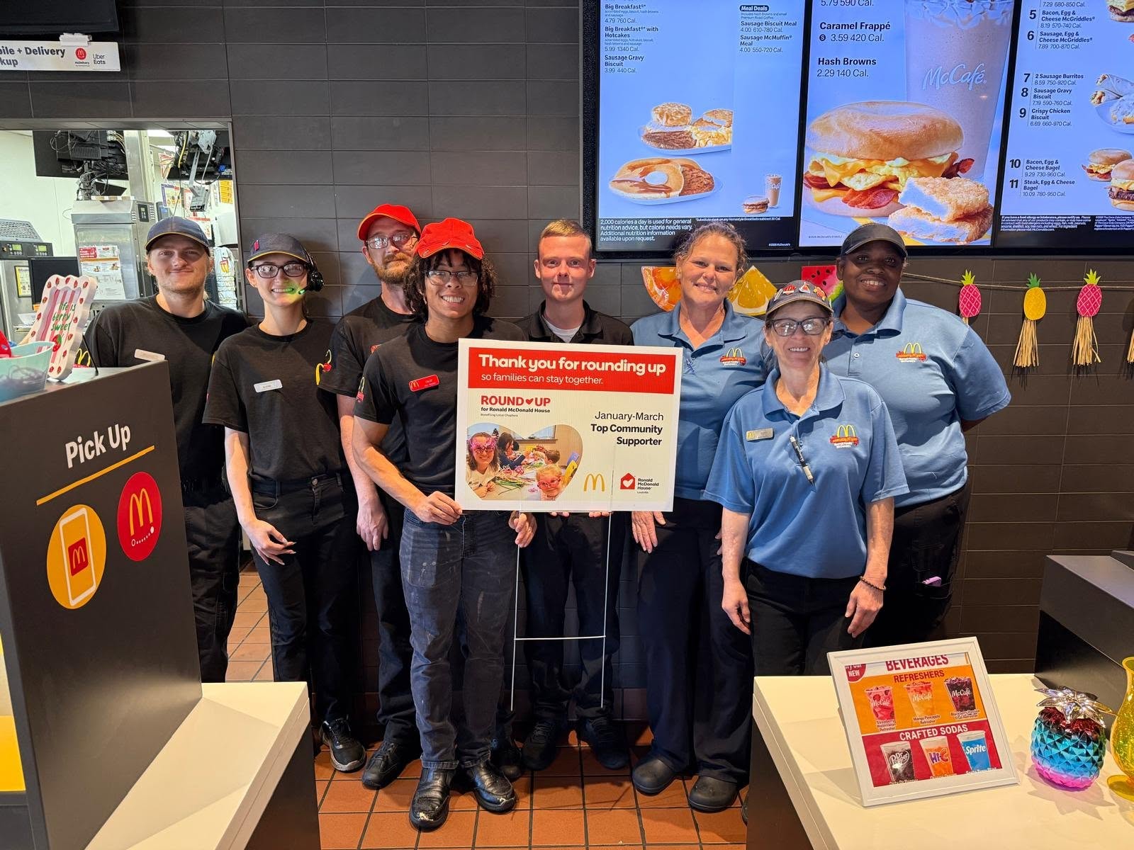 Burrell Family McDonald's crew celebrating a Ronald McDonald House Round-Up community award