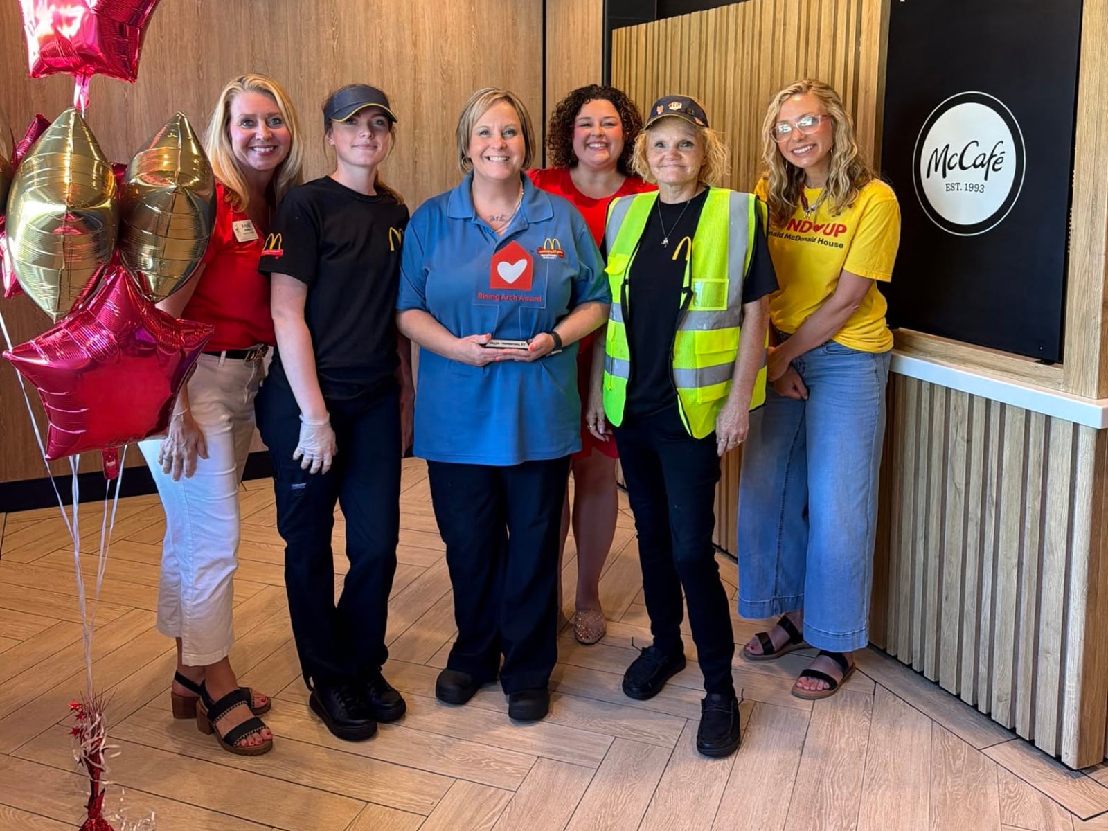 Burrell Family McDonald's crew celebrating a Ronald McDonald House Rising Arch Award